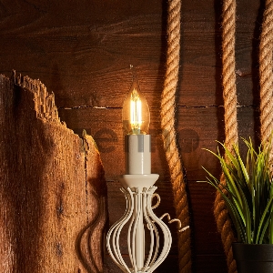 Лампа филаментная REXANT Свеча на ветру CN37 7.5 Вт 600 Лм 2700K E14 диммируемая, прозрачная колба