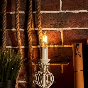 Лампа филаментная REXANT Свеча CN35 7.5 Вт 600 Лм 2700K E14 диммируемая, прозрачная колба